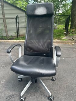 Comfortable black leather office chair with mesh back and armrests $50 Cash only. Cross posted