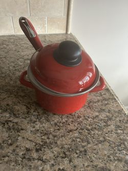 Attractive Red Pot and Lid with Red Spatula