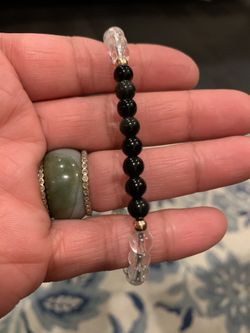 Black Obsidian surrounded by Clear Quartz in Gold beads