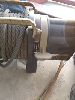 12 olt 25000 lbs winch works great 350.00