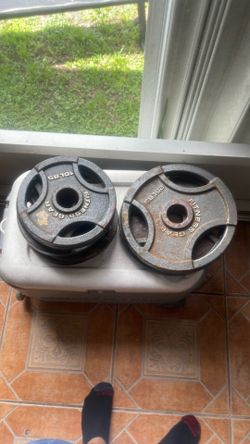 Six 10 Pound/Two 25 Pound Olympic Barbell Plates