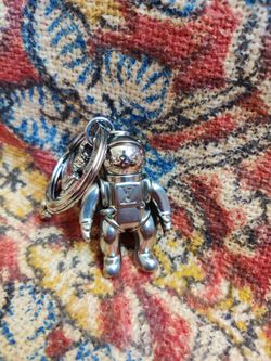 Louis Vuitton Spaceman Metal Charm/Keychain for Sale in Queens, NY - OfferUp