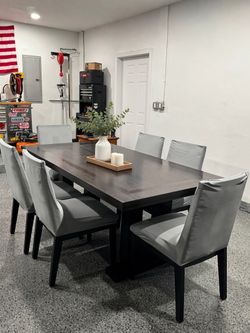 Dark wood dining table + 6 chairs