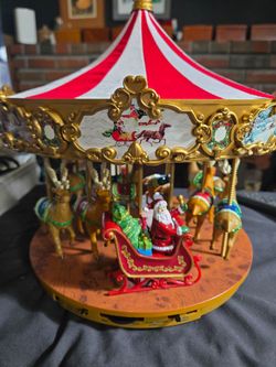 Mr. Christmas Very Merry Carousel, featuring Santa in his sleigh pulled by animated reindeer