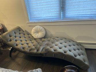 Taupe colored velvet chaise.