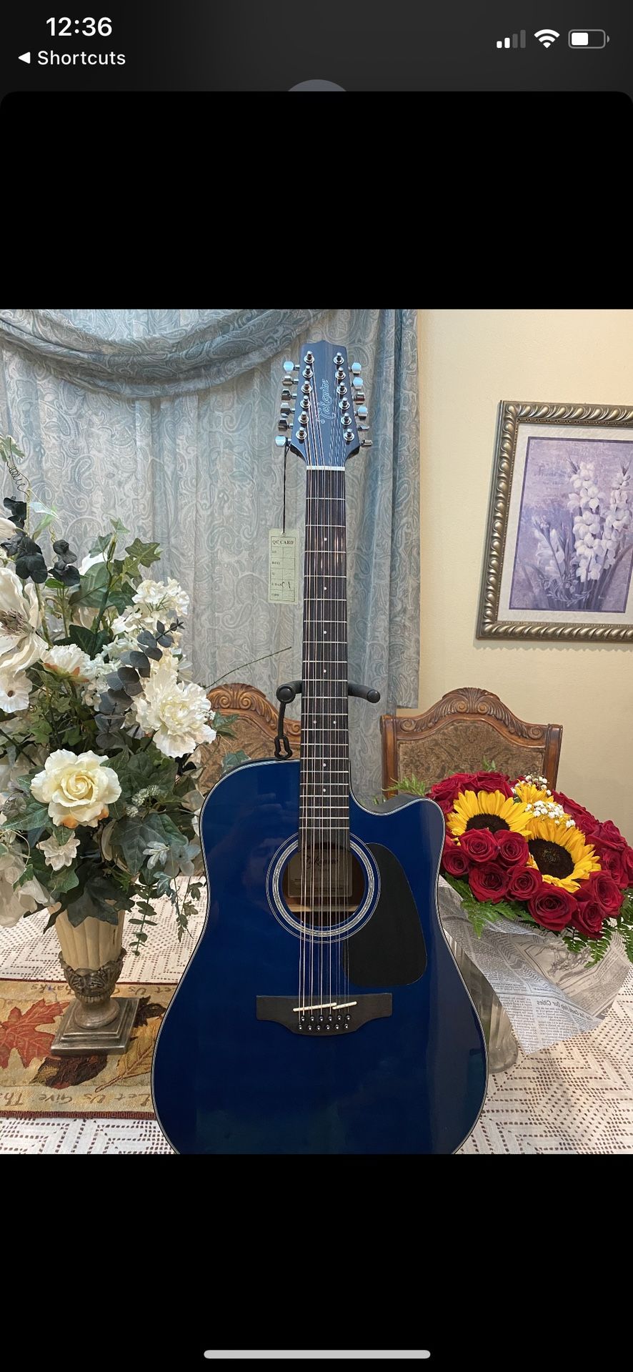 blue takamine 12 string electric acoustic guitar with built in tuner