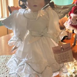 Porcelain doll with beautiful dress and intricate details