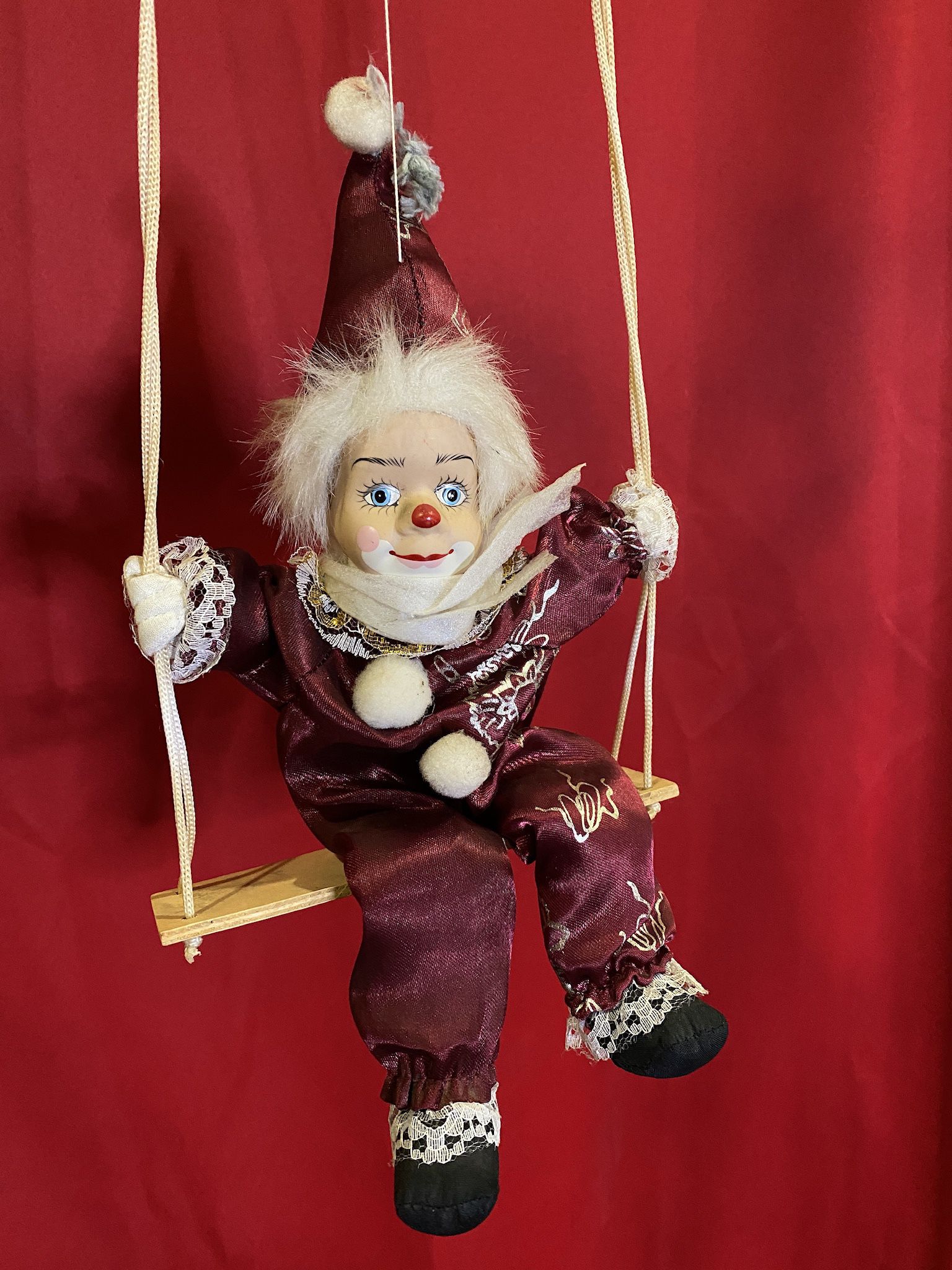 Clown Porcelain Doll On A Swing
