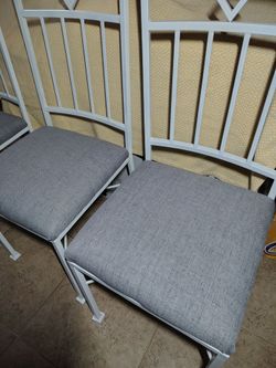 Four Iron chairs