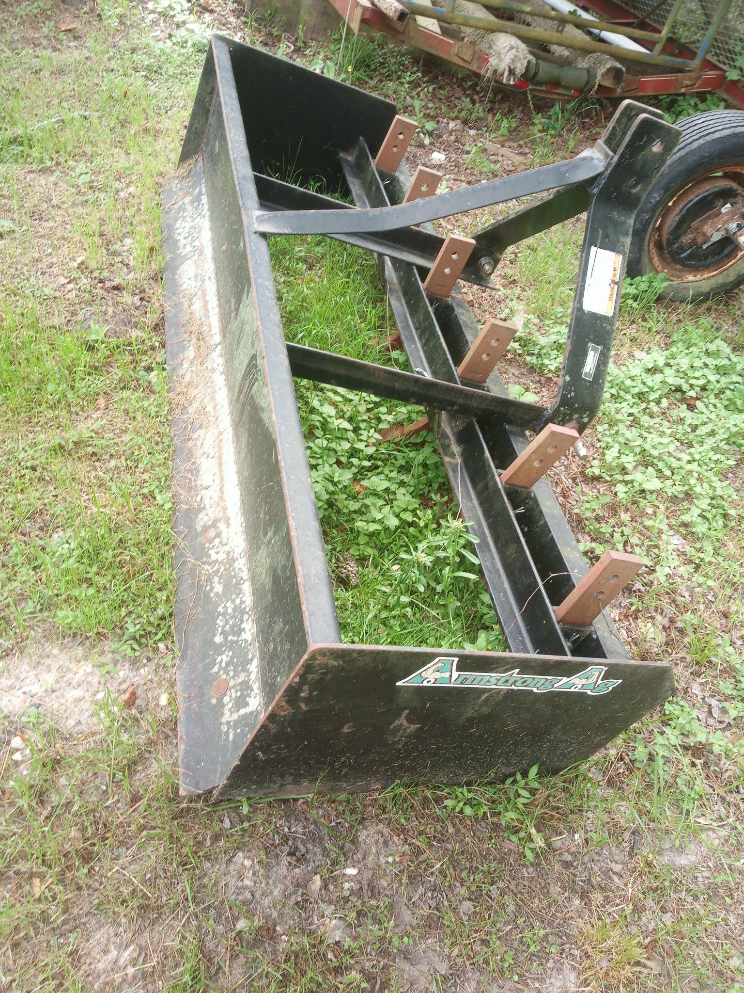 Four implement tractor implements a row plow tiller and auger 6ft box blade and 6ft brush hog plus feed trough putting new metal on brush hog today