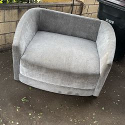 Grey Spinning Living Spaces Cozy Sofa Chair.  