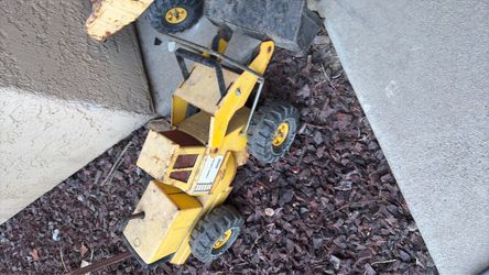 Two tonka trucks