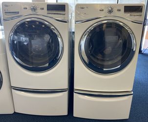 White Whirlpool Duet Front Load Washing Machine and Gas Dryer Set on Pedestals (0-0007)