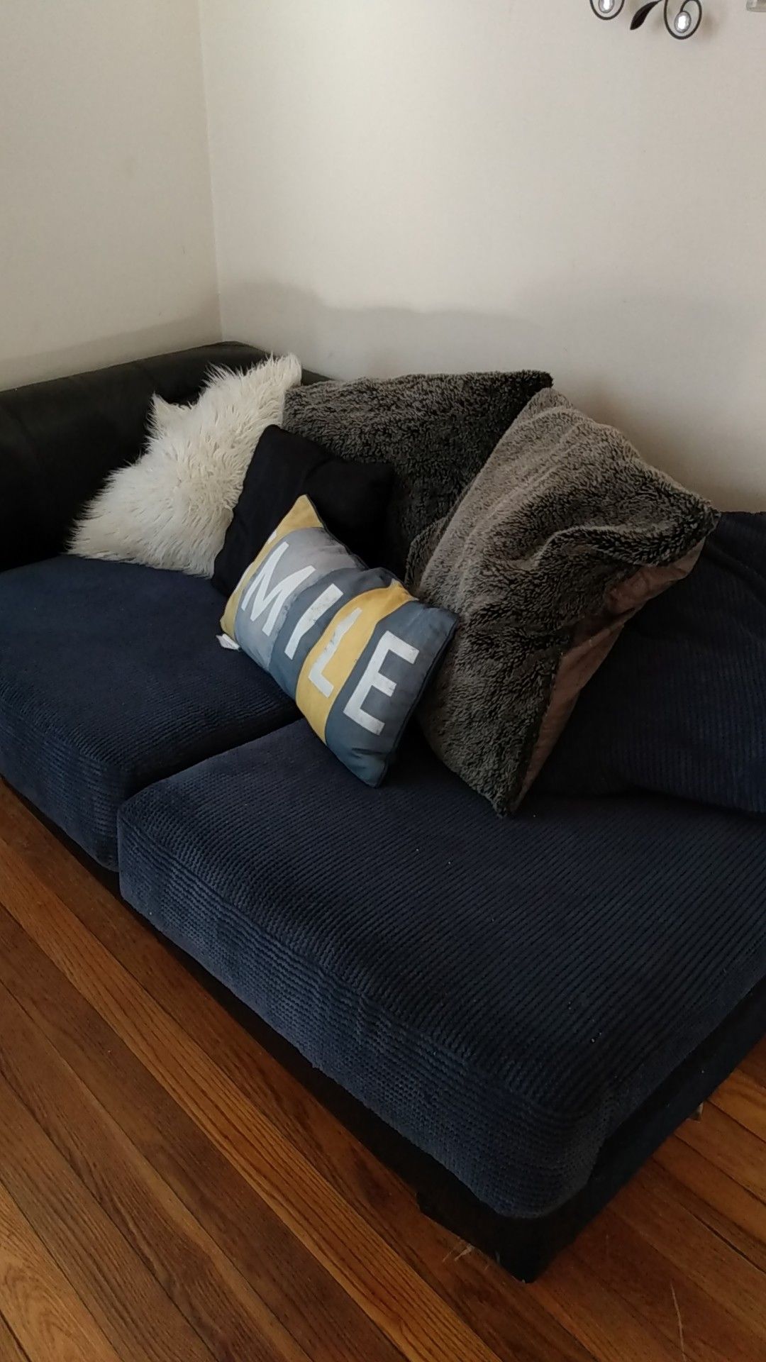 1 blue couch with pillows