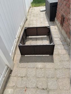 Wicker outdoor table top. Glass missing