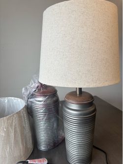 pair of brand new lamps, and a  diaper changing table, $95