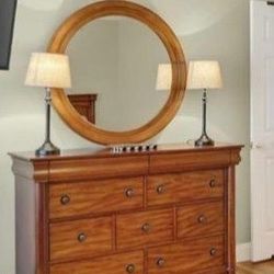Wood Dresser with Mirror for Sale 🪞
Beautiful solid wood dresser with matching round mirror.
Very sturdy, clean, and in great condition.
Perfect for 