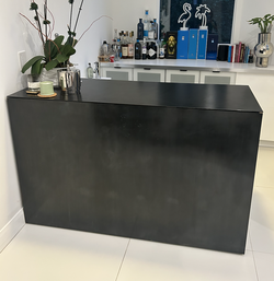 Black metal home bar with glass top with wood open shelving