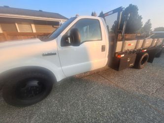 Flatbed truck.  Ford f350 gas engine 145 miles