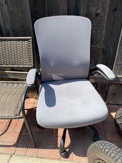 Grey office chair and plastic boxes