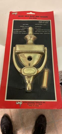 Brass door knocker with viewing eye