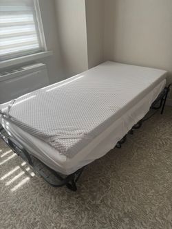 Deluxe twin folding bed Includes 3 inch memory  foam mattress topper for even more comfort