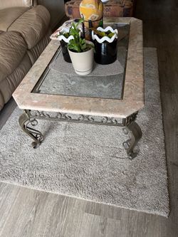 Very heavy glass top marble base table takes two people to carry it