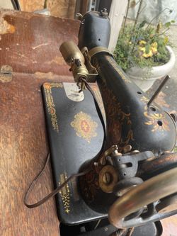 Vintage sewing machine with cabinet still works
