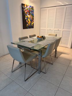 Modern Glass Dining Table with 6 beige chairs