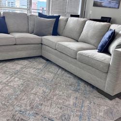 Sectional sofa with feather cushions