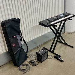 Roland Juno-DS61 keyboard synthesizer w/ stand/amp/case/pedal (yes it works) 