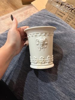 White Ceramic Vase with Embossed Face Detail