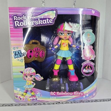 JAKKS Pacific Rock N Rollerskate Doll Rainbow Riley Light Up Remote Control Rollerskating Doll - Plays Music and Skates!, 10" H
