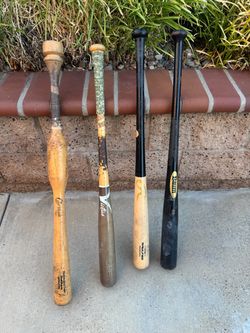 3 Wood bats 1 trainer bat