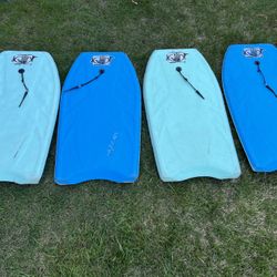 four adult boogie boards