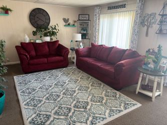Must sell burgundy couch /loveseat and rug