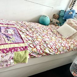 Twin Size Bed With Extra Bottom Mattress And White Shelves 