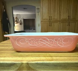 Pink Pyrex scroll casserole dish