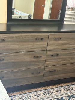 Bed frame, mattress, and mirror with dresser