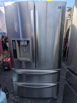 LG 4 door refrigerator/3 months of warranty and free local  delivery
