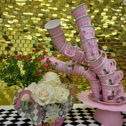 A centerpiece decoration for the table "Alice in Wonderland".A stand with cups. Handmade.