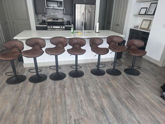 7 Bellatier Brown Tall Swivel Barstool, manufacturer Ashley Furniture