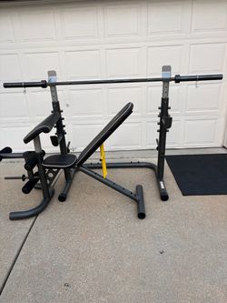 Golds Gym Adjustable Bench, rack and cap 45Lb Olympic barbell 7ft $200