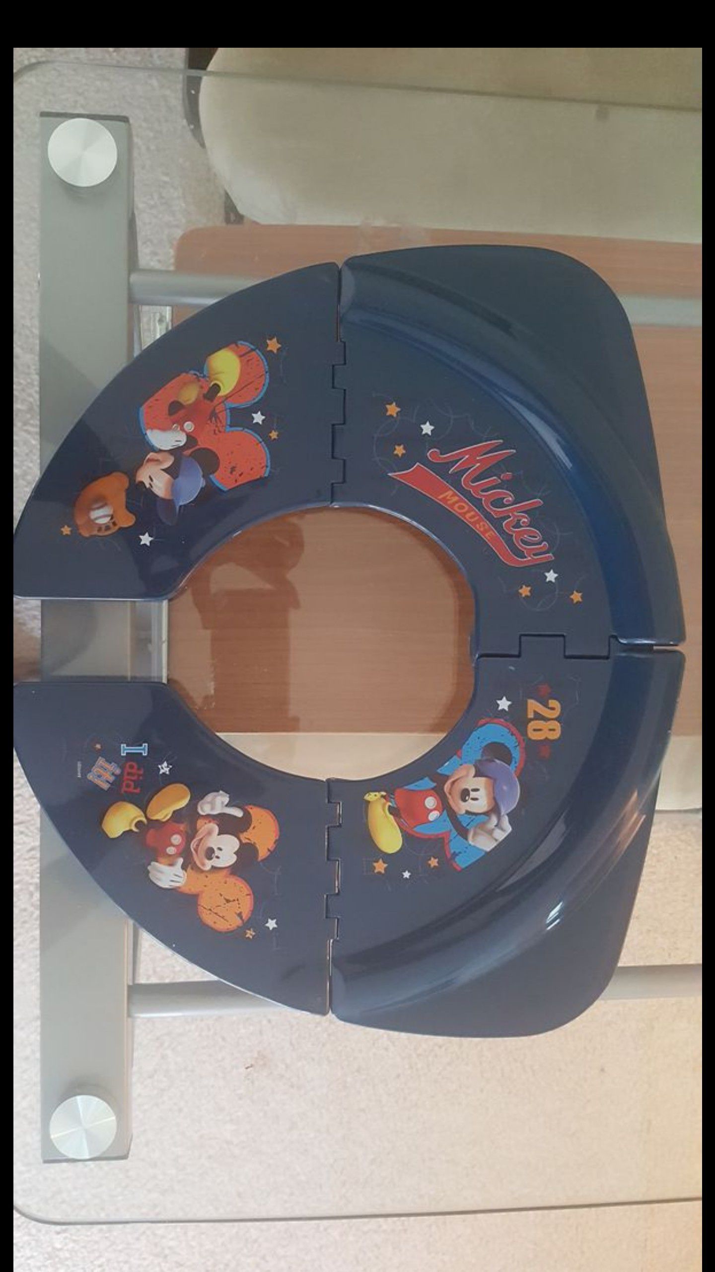 NEVER USED - Portable foldable micky mouse potty seat in a bag