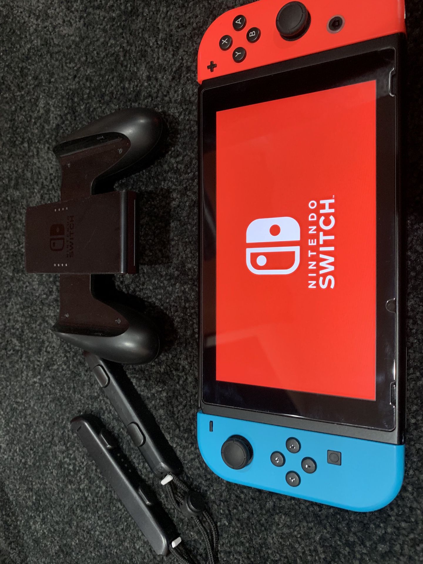Nintendo switch console neon red and blue