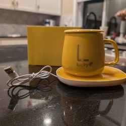 Mug, lid, spoon and warmer set