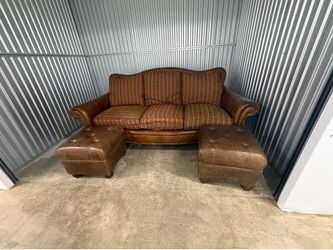 Brown leather couch and ottomans