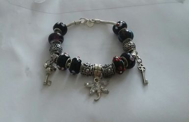 Brand New 925SS Black Murano Charm Bracelet.