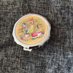 vintage-style silver metal compact mirror, $35