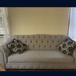 Grey Loveseat And Sofa With Pillows
